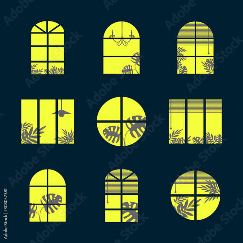 Collection of windows silhouette of various designs isolated. Windows light city at night. Vector illustration of apartment blocks with windows, in which the gap silhouettes of tropical and home photo