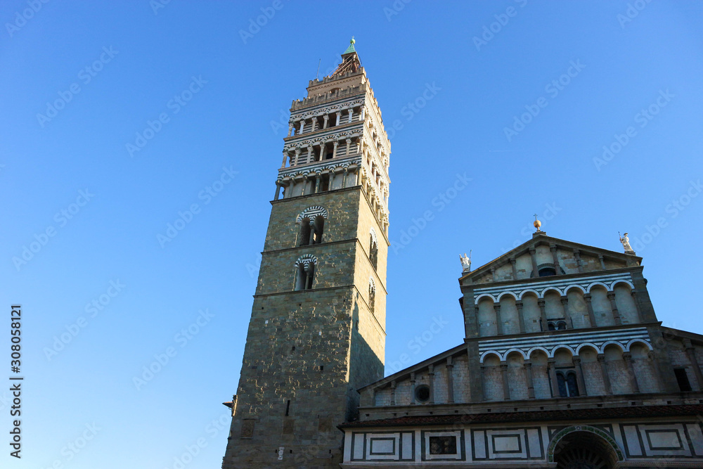 View of Pistoia Cathedral san zeno with medieval clock bell tower, Tuscany, Italy
