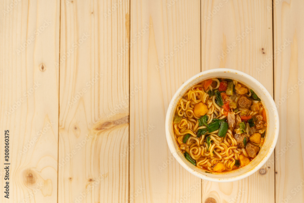 cup noodles soup on wood table background cup noodles soup on wood table background