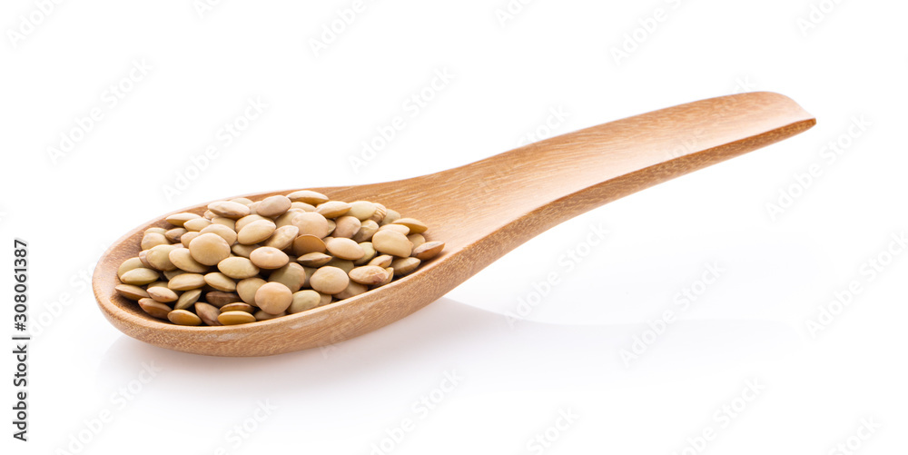 lentils in wood spoon on isolated white lentils in wood spoon on isolated white