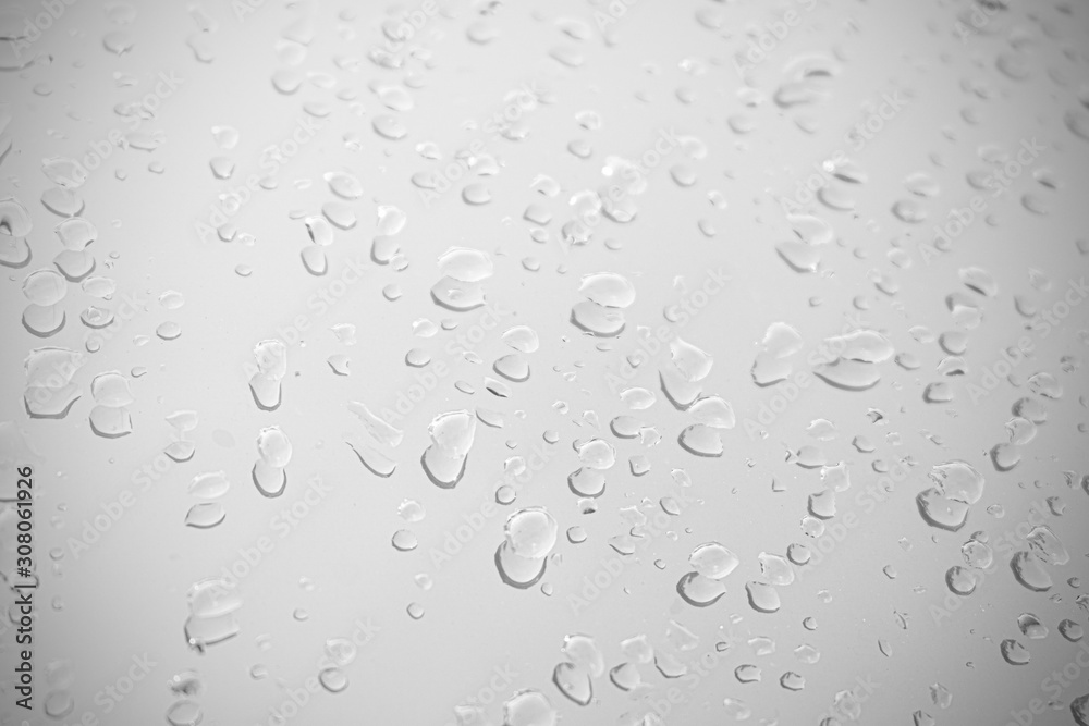 Raindrop water dew drop on glass wet white gray blue background. Raindrop water dew drop on glass wet white gray blue background.