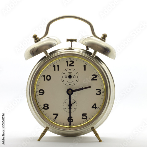 Old-style alarm clock, metal, it's half past two.