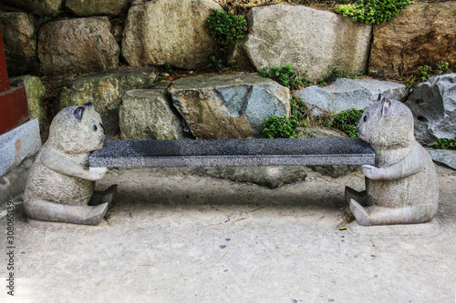 Stone bench near the entrance to Haedong Yonggungsa Temple in Busan, South Korea.