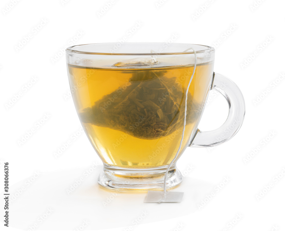 Cup of green tea with jasmine and pyramid tea bag isolated on white Cup of green tea with jasmine and pyramid tea bag isolated on white