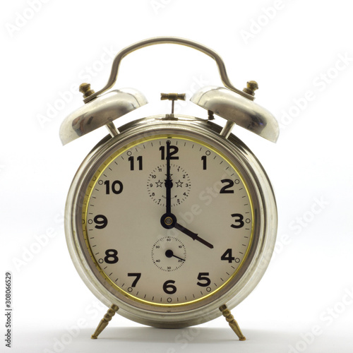 Old-style alarm clock, metal, it's four o'clock.