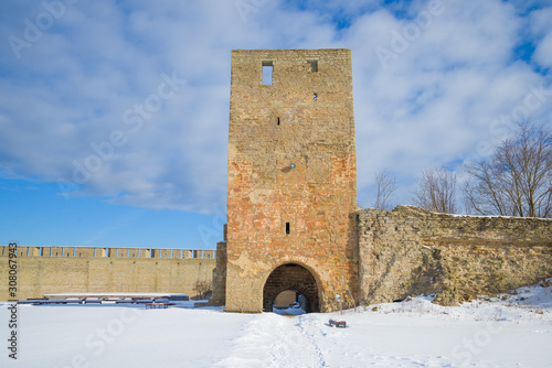 Ancient Alarm tower close-up Sunny March day. Ivangorod fortress, Russia photo