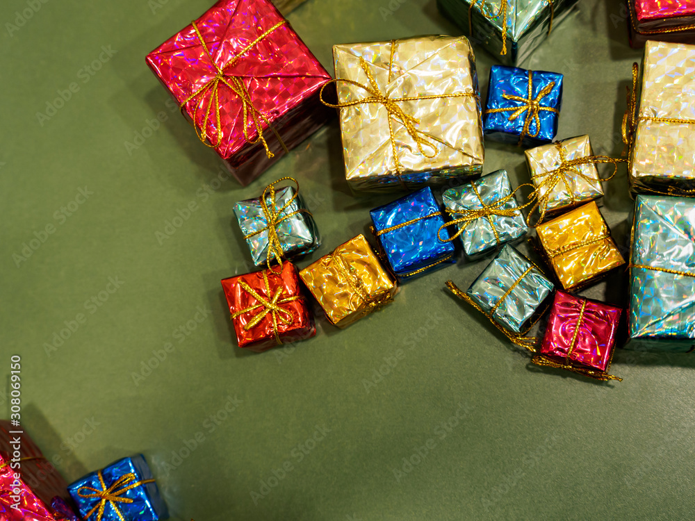 Flat lay of presents wrapped in shiny paper and ribbons. Christmas / Xmas/ Birthday gifts theme