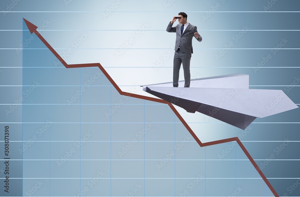 Businessman flying on paper plane in business concept Businessman flying on paper plane in business concept