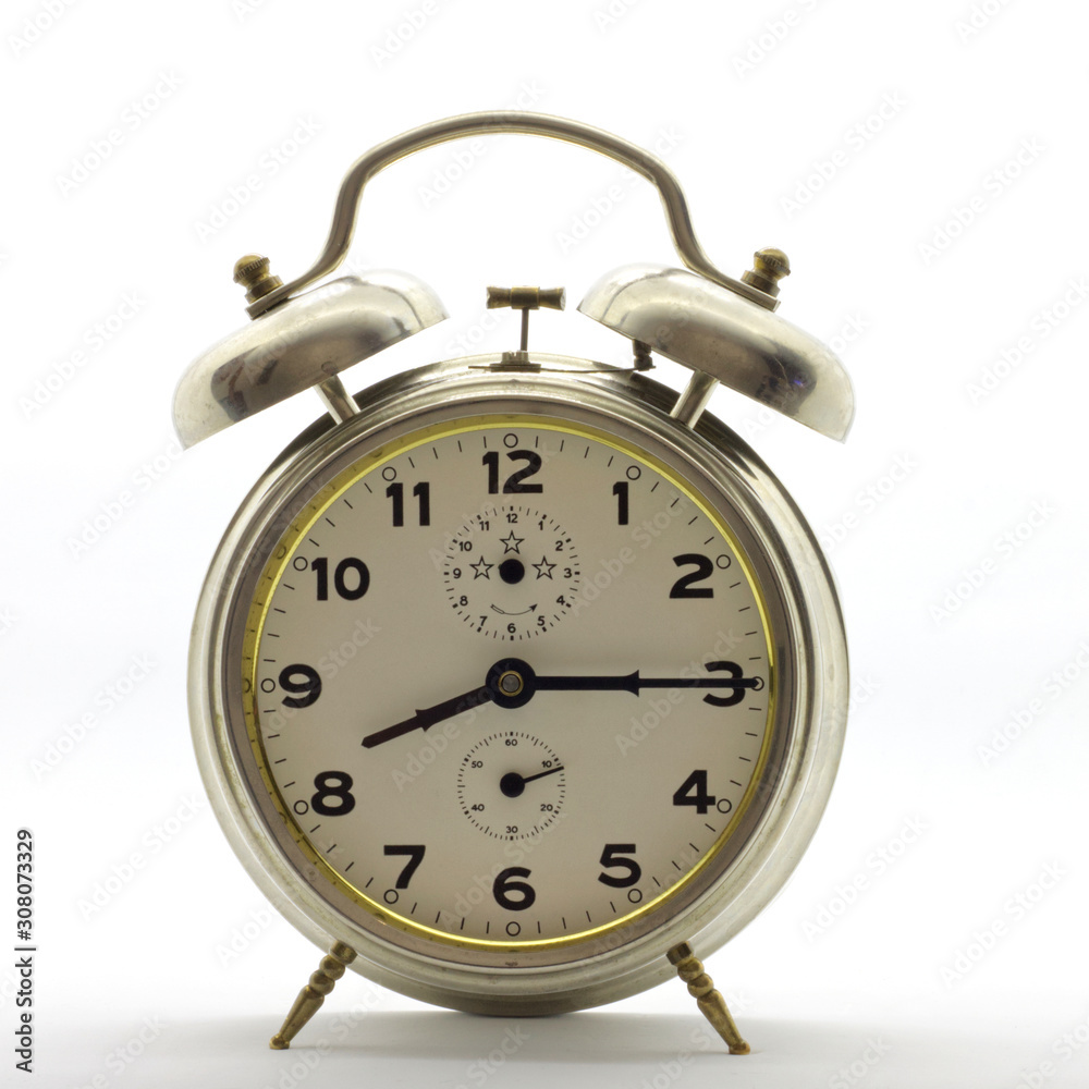 Old-style alarm clock, metal, it's quarter past eight.