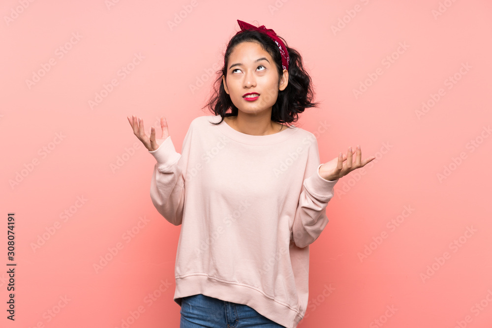 Asian young woman over isolated pink background frustrated by a bad situation Asian young woman over isolated pink background frustrated by a bad situation