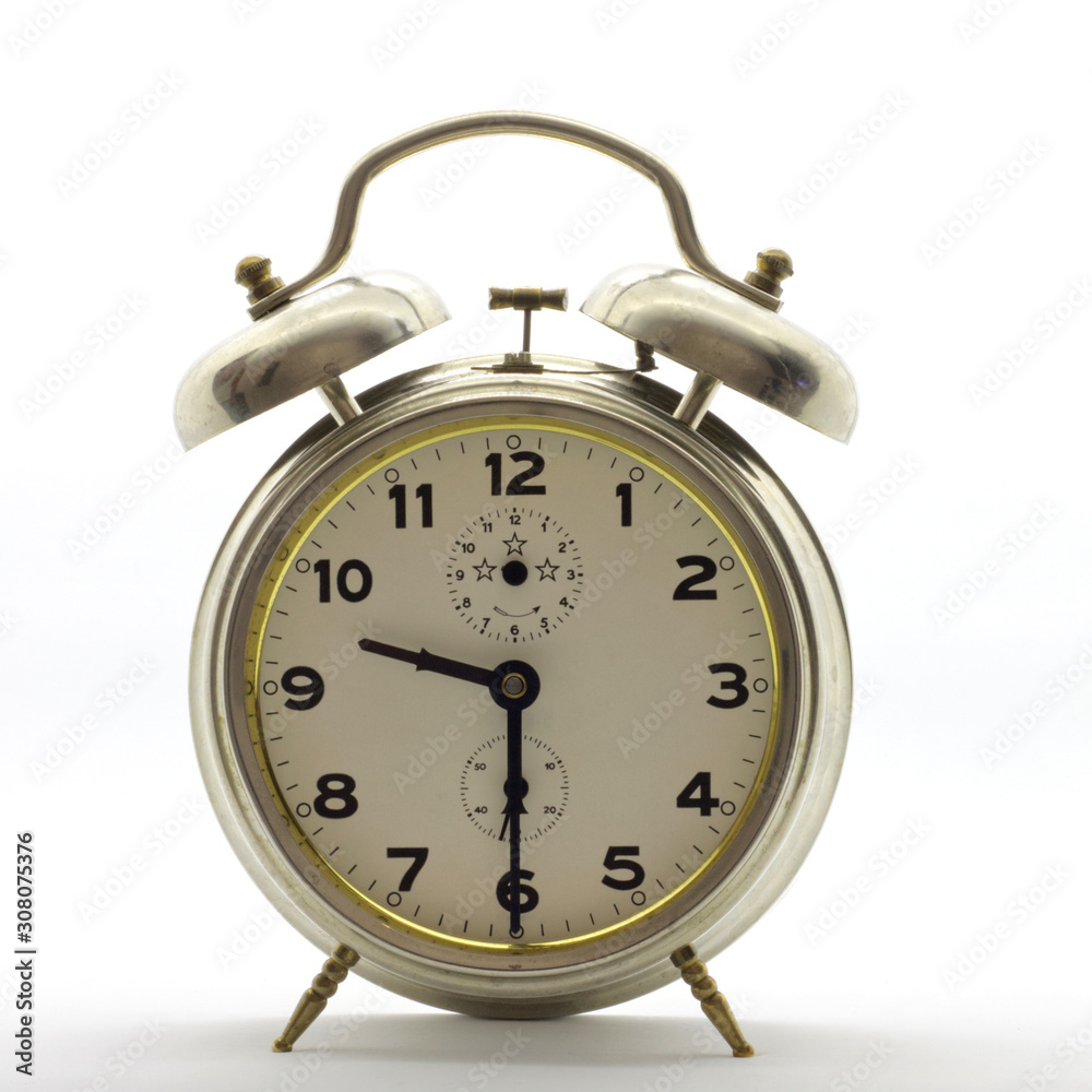 Old-style alarm clock, metal, it's half past nine. Old-style alarm clock, metal, it's half past nine.