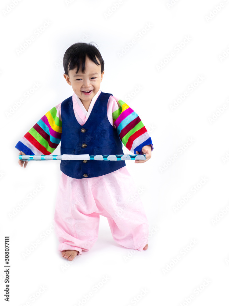 Asian little boy wearing a Korean Traditional Hanbok dress in white background Asian little boy wearing a Korean Traditional Hanbok dress in white background