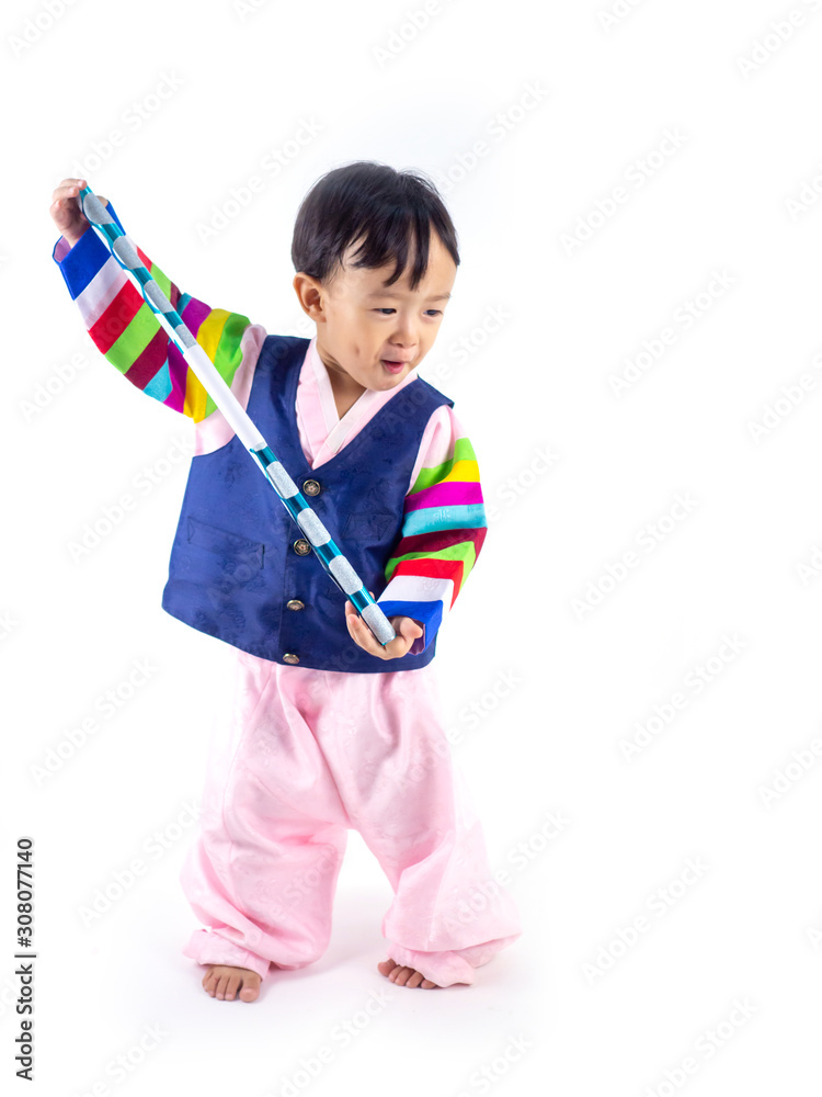 Asian little boy wearing a Korean Traditional Hanbok dress in white background Asian little boy wearing a Korean Traditional Hanbok dress in white background