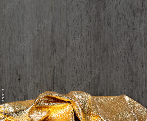 Fototapeta Naklejka Na Ścianę i Meble -  wooden dark texture with gold textil,
