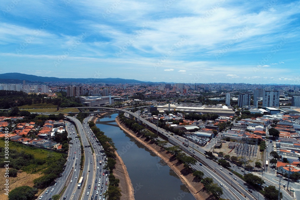 Aerial view of river between roads. Cityscape scenery. Great landscape. Marginal Tietê, São Paulo, Brazil