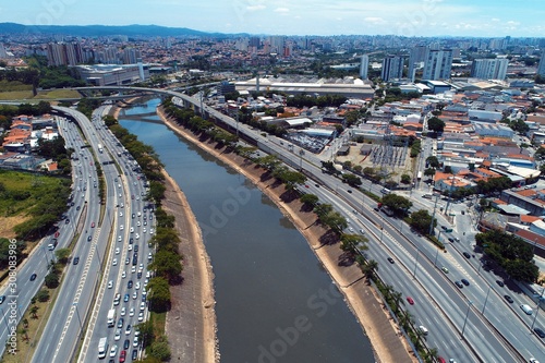 Aerial view of river between roads. Cityscape scenery. Great landscape. Marginal Tietê, São Paulo, Brazil © ByDroneVideos