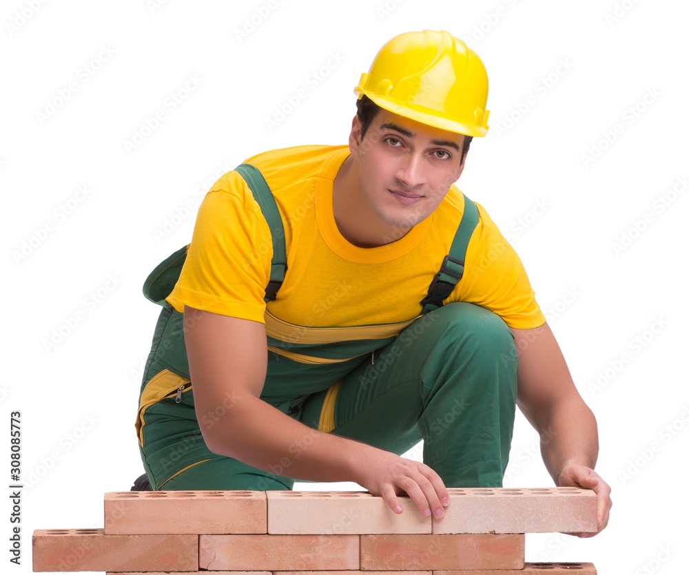 The handsome construction worker building brick wall The handsome construction worker building brick wall