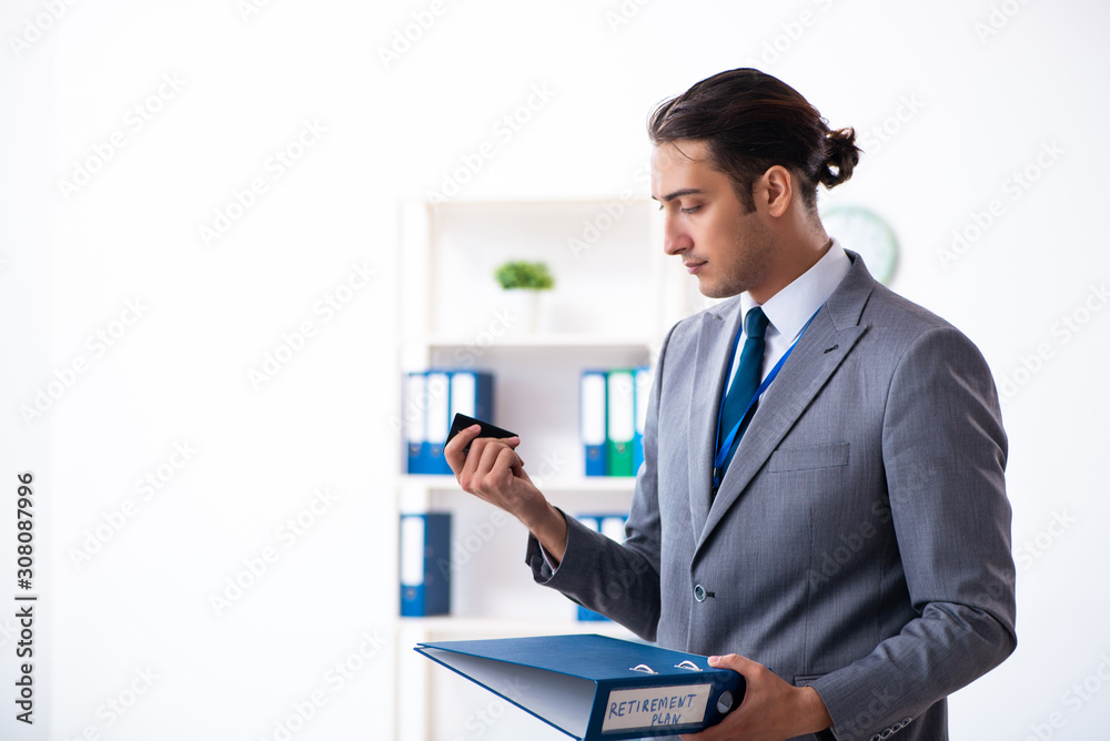 Young male accountant working in the office Young male accountant working in the office