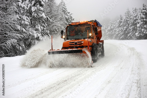 Snowplow. Forest roads full of snow and ice.