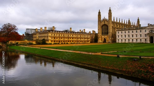 Cambridge, UK. View of Cambridge University with King College Chapel in Cambridge, England, UK during the cloudy autumn day. Time-lapse with boats in the river, zoom in photo