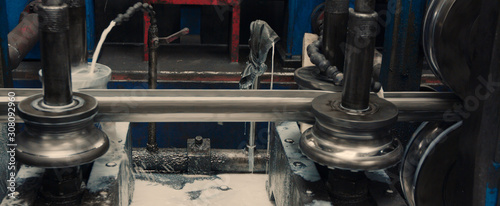Steel cog gear set of metal sheet bending machine in metalwork factory.