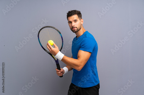 Handsome young tennis player man © luismolinero