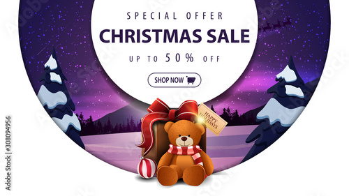 Special offer, Christmas sale, up to 50%, white discount banner with decorative big rings, winter landscape and present with Teddy bear