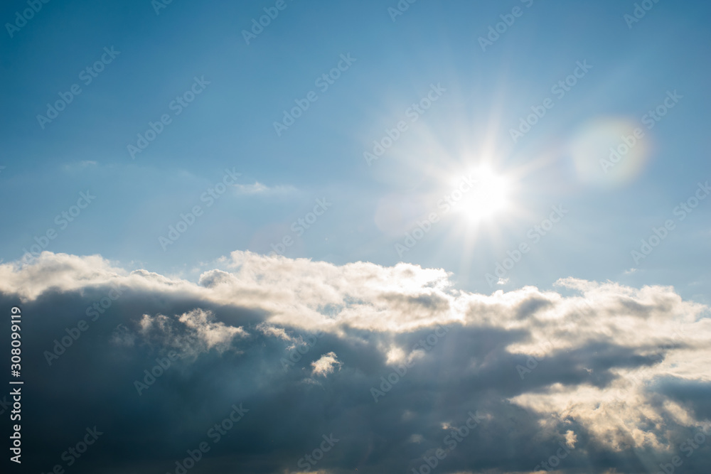 the sun's rays shine through the clouds. cloudy sky, background