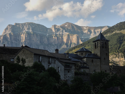 The Church of Torla and the walls of Mondarruego in the National Park of Ordesa and Monte Perdido in the Pyrenees of the province of Huesca. Aragon. Spain
