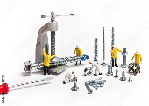 Construction crew with mounting material of different calibers on a white background. People are dolls.