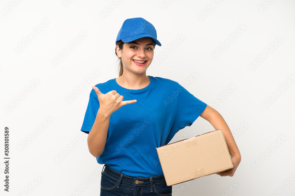 Young delivery girl over isolated white background making phone gesture Young delivery girl over isolated white background making phone gesture