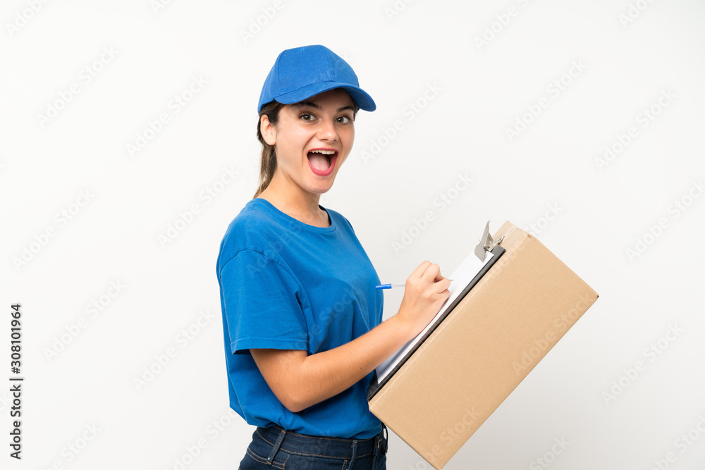 Young delivery girl over isolated white background Young delivery girl over isolated white background