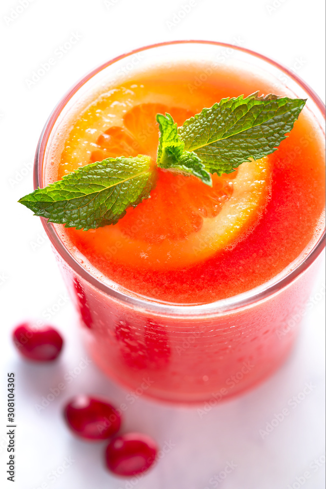 Fresh Homemade Cranberry Orange Juice with Mint Garnish Fresh Homemade Cranberry Orange Juice with Mint Garnish