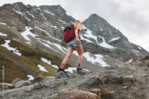 Vacation in mountains woman hiking alone adventure trail healthy lifestyle outdoor summer activity trekking in Norway endurance training motivation concept