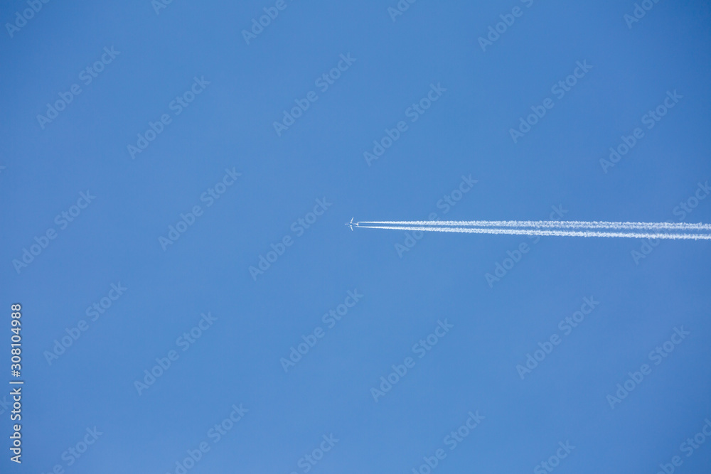 Airplan flies in a blue sky