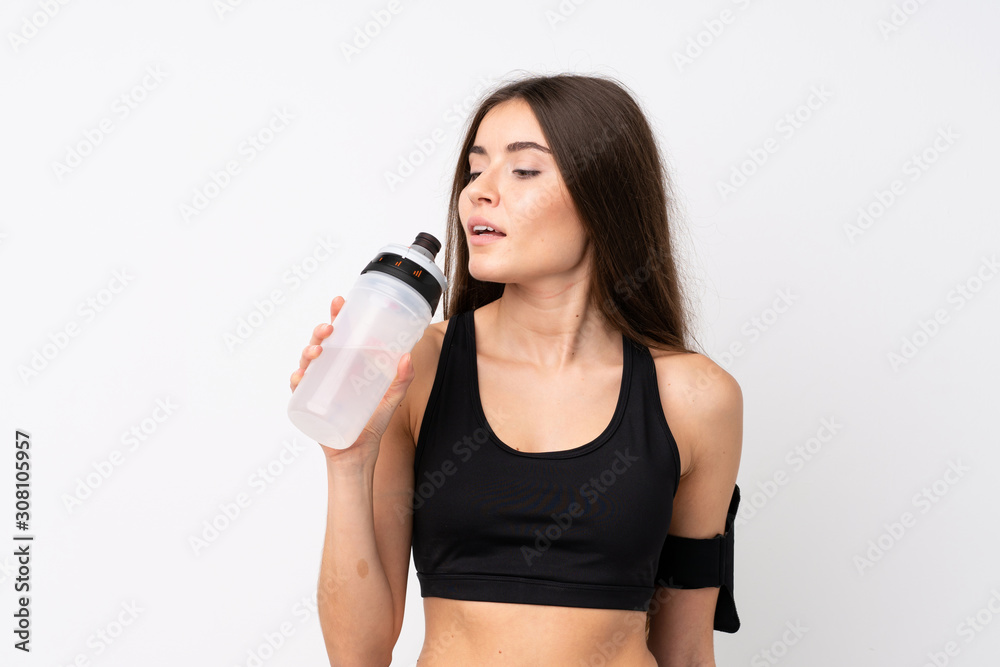 Young sport woman over isolated white background with sports water bottle Young sport woman over isolated white background with sports water bottle