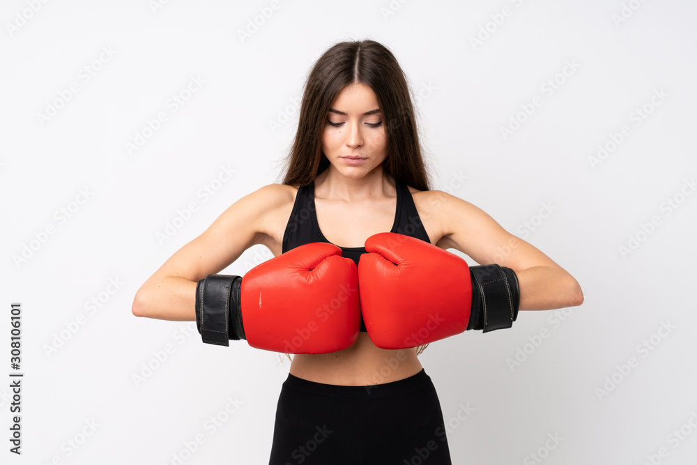 Young sport woman over isolated white background with boxing gloves Young sport woman over isolated white background with boxing gloves