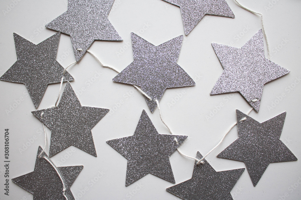 garland of silver stars. flat lay style. xmas holiday theme garland of silver stars. flat lay style. xmas holiday theme
