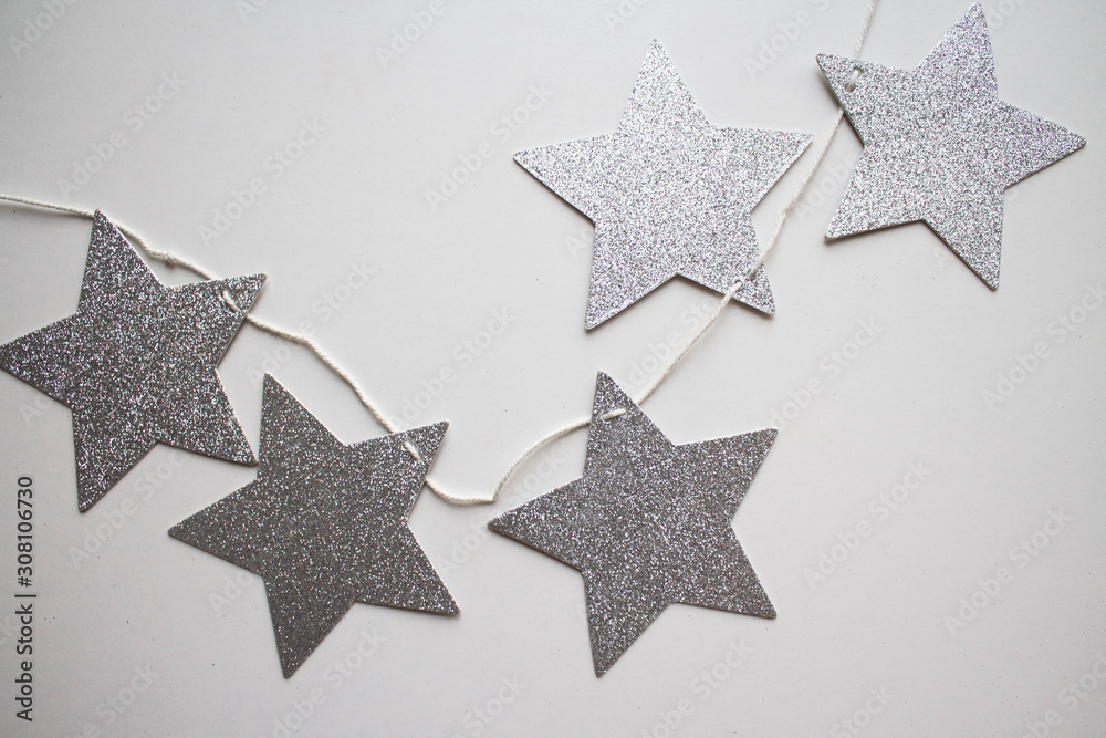 garland of silver stars. flat lay style. xmas holiday theme garland of silver stars. flat lay style. xmas holiday theme