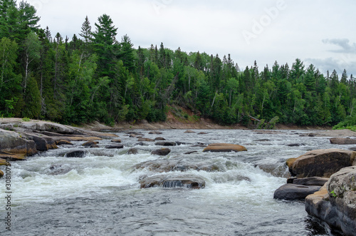 Rapid moving water at Pabineau Falls, New Brunswick, Canada