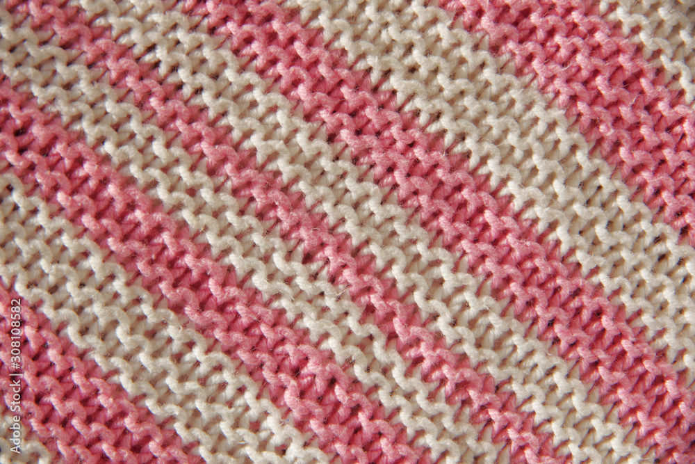 white and pink knitted stripes background