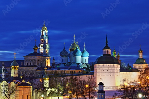 Famous Russia Golden Ring landmark Trinity St. Sergius Lavra in winter night, beautiful Sergiev Posad bright photo on blue sky background from Observation deck