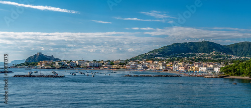 Panoramic view of the coastline, the city of Ischia Porto and the Aragonese castle. Italy, Ischia