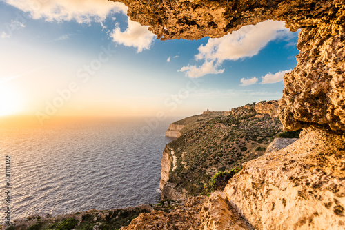 Fotografia Sunset over cliffs in Malta.