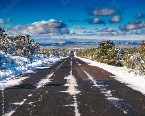 Arizona Highway 89 US with view of snowed mountains in Humphreys peak near Flagstaff photo