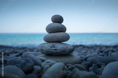 Pyramid of stones for meditation lying on the sea coast at Crete island
