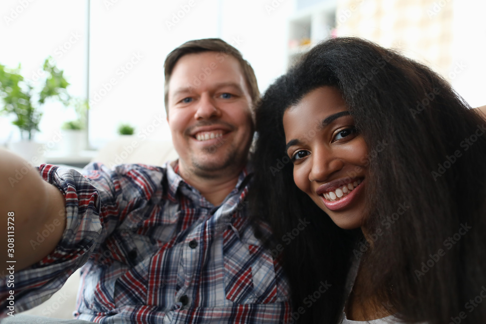 Diverse millennial couple people make face selfie Diverse millennial couple people make face selfie