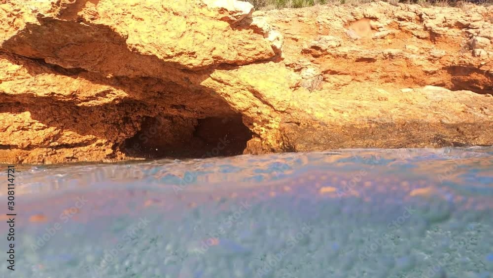 Underwater sea level video of cave with tropical turquoise crystal clear sea Underwater sea level video of cave with tropical turquoise crystal clear sea