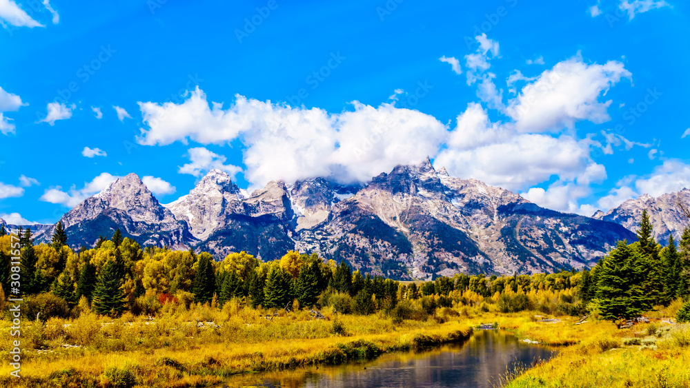 Fototapeta premium Reflections of the Grand Tetons Peaks in the waters of the Snake River at Schwabacher Landing in Grand Tetons National Park, Wyoming, United States