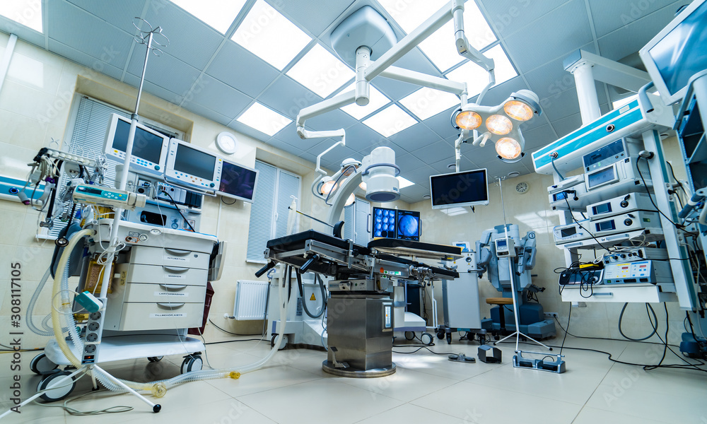 Hospital interior with operating surgery table, lamps and ultra modern devices, technology in modern clinic